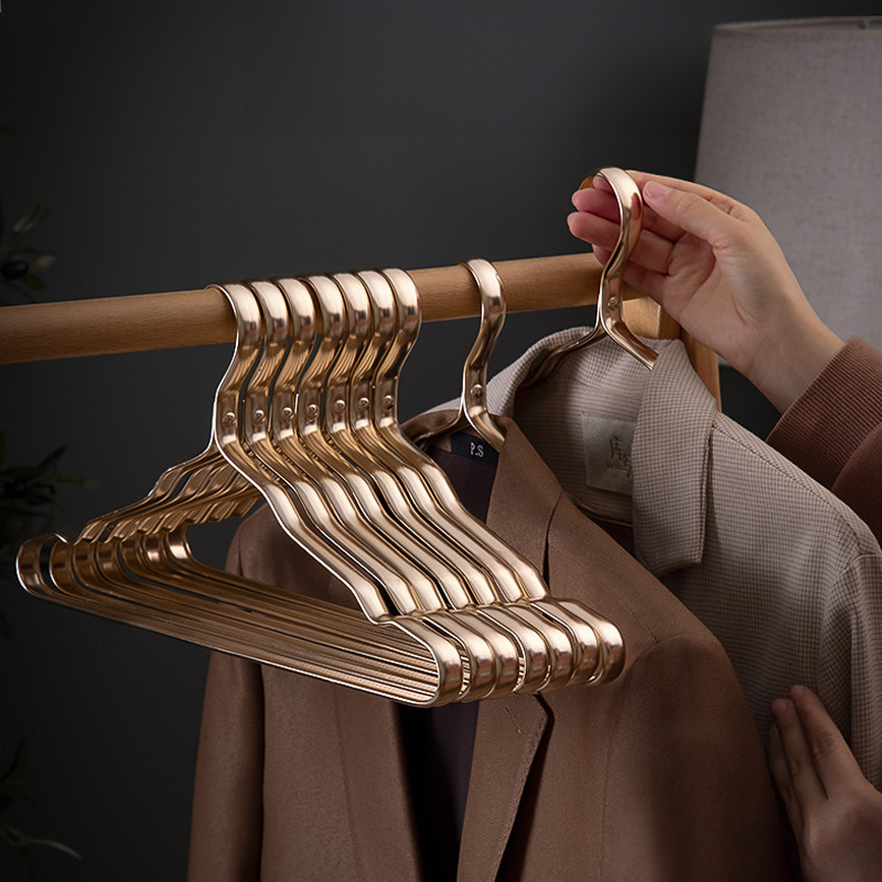 Gold Clothes Hangers with Polished Metal Design